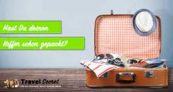 Koffer mit Kleidern als Gepäck für Reisen