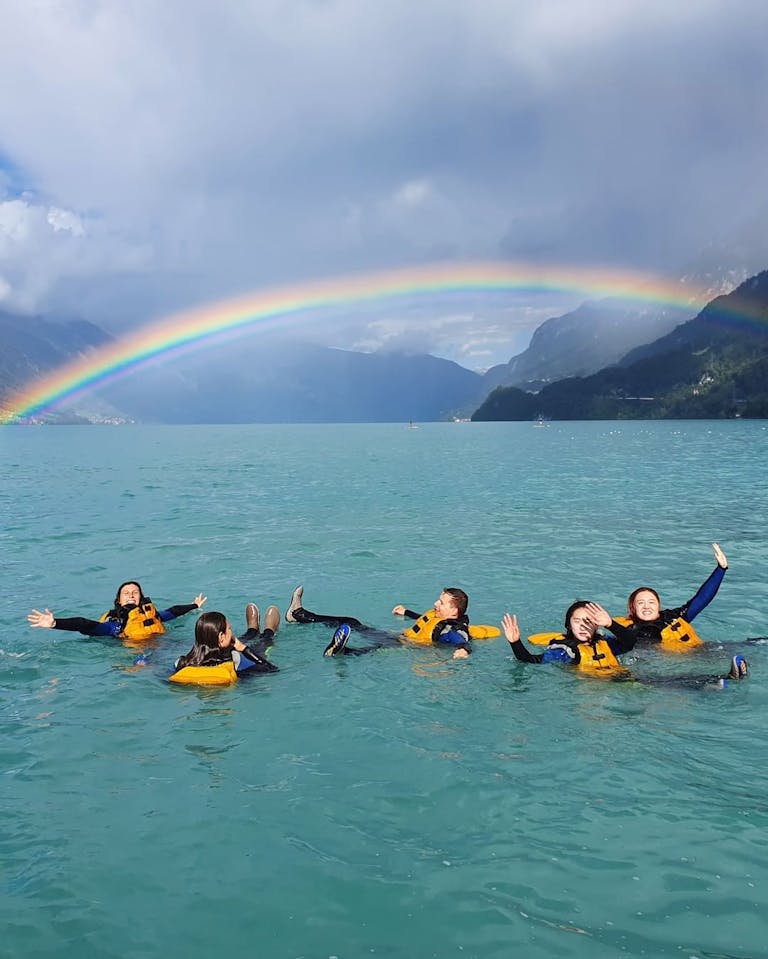 Rafting on Lütschine with a Rainbow in the Background